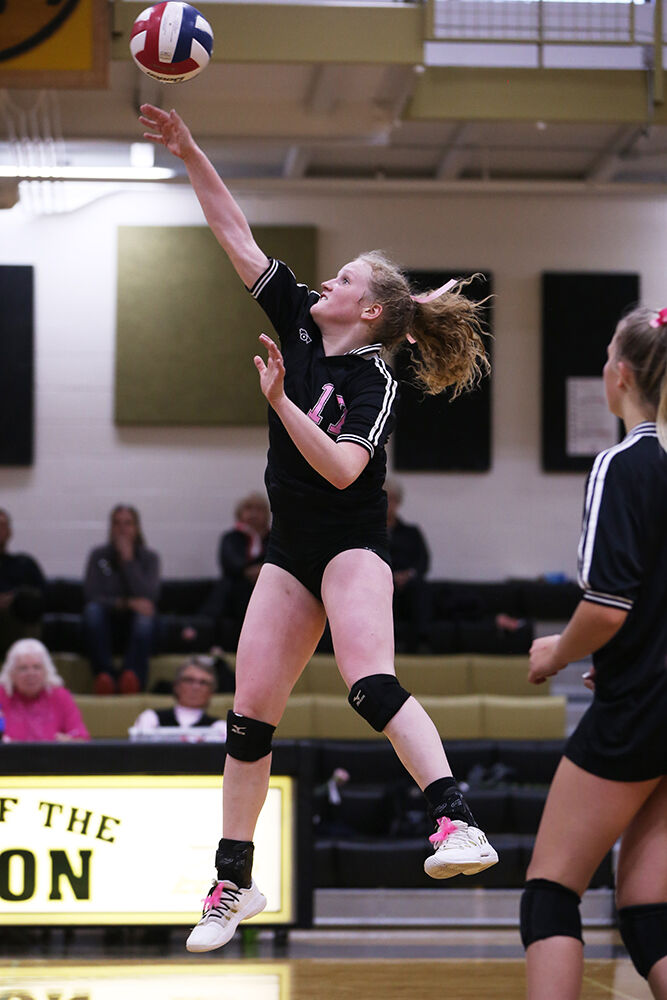 Tessa Taylor makes a middle hit during the third set against Douglas